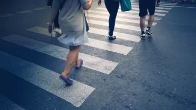 Close-up of the feet of pedestrians in a crosswalk