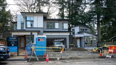 New modern home in grays with ADU and porta-potty out front being built in Kirkland, Washington.