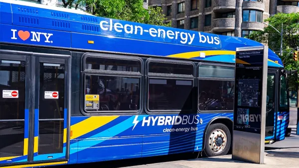 Blue electric transit bus in Manhattan with I <3 NY logo on side.