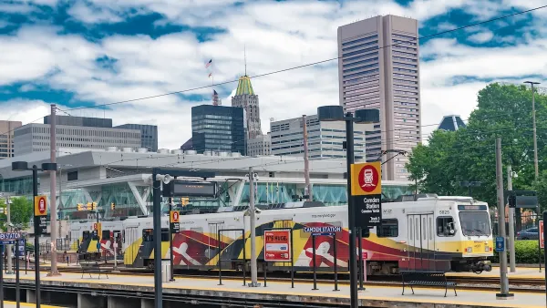 Camden Station train platform with white and red tram in Baltimore, Maryland.