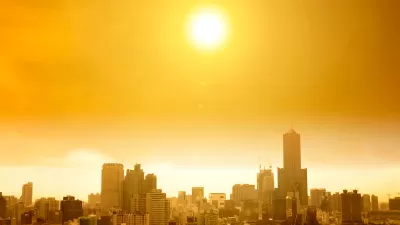 View of hazy city skyline in yellow smog indicating extreme heat.