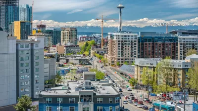View of downtown Seattle with Space Needle and mountains in background