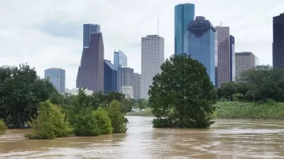 Flooded park agains the downtown Houston skyline