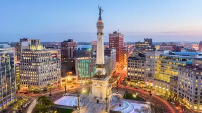 Aerial view of statue on top of tall obelisk in downtown Indianapolis, Indiana.