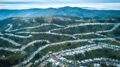 Aerial view of homes on green hillsides in Daly City, California.