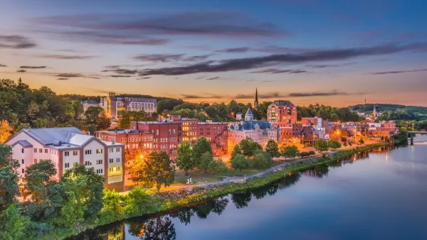 Augusta, Maine skyline viewed from across river at dusk.