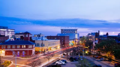 View of low-rise buildings in downtown Durham, North Carolina at sunset.