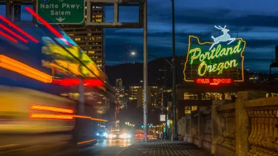 Portland Oregon Old Town neon sign and blurred traffic at night.