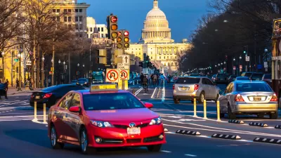 Traffic on Pennsylvania Avenue with U.S. Capitol dome in background