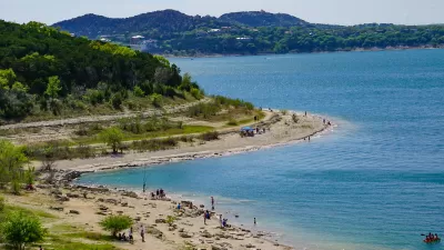 Aerial view of blue Canyon Lake reservoir beach in Texas on sunny day.