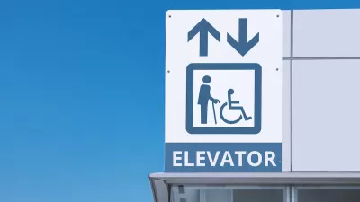 Close-up of subway station elevator sign.