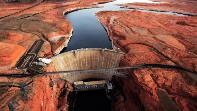 Aerial view of Glen Canyon Dam on Colorado River among red rocks