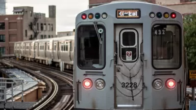Silver train on elevated rail in Chicago, Illinois.