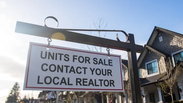 "Units for sale - contact your local realtor" sign in front of homes.