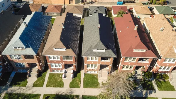 Aerial view of narrow two-story Chicago townhomes.
