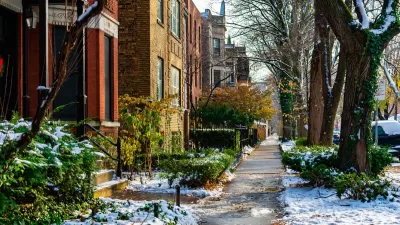 Chicago sidewalk with brick homes in winter.