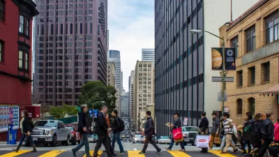 People crossing street at crosswalk in downtown San Francisco, California