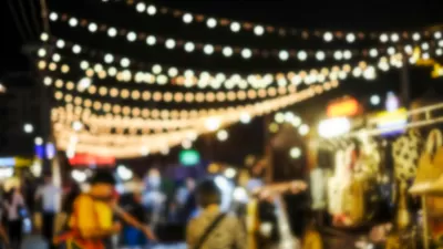 Blurred image of people shopping at night market