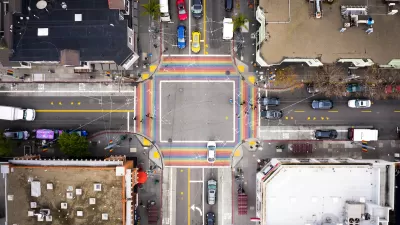 Bird's eye view of rainbow-colored crosswalk in the Castro district in San Francisco, California.