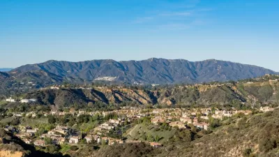 Homes in Altadena, California with mountains in background on a sunny day.