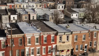 Aerial view of three-story brick rowhouses in Kensington neighborhood of Phialdelphia, Pennsylvania