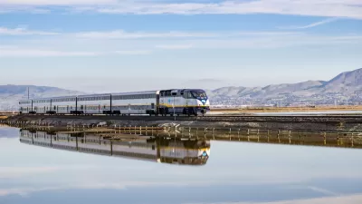 Amtrak train passing over bridge on Alviso Marsh near San Jose, California.