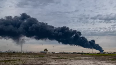 Black plume of smoke rising from petrochemical plant fire in Houston, Texas