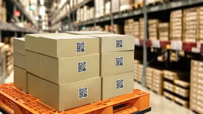 Boxes stacked on an orange cart in a large warehouse with racks in background