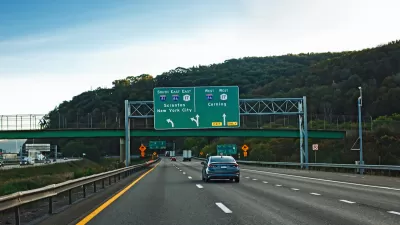 Freeway in New York State with signs for New York City and Scranton.