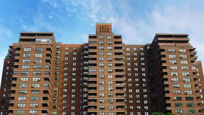 Looking up at red brick public housnig high-rise building in New York City