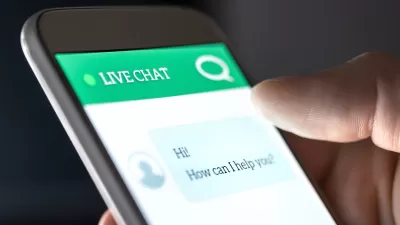 View of a phone with a chatbot interface asking user how it can help them.