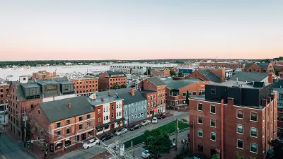 Aerial view of mid-rise brick buildings in Portland, Maine on waterfront.