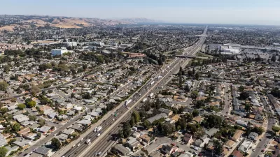 Aerial view of highway through neighborhood in Oakland, California.