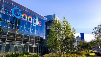 Glass office building with multicolored Google logo on Google headquarters campus in Mountain View, California