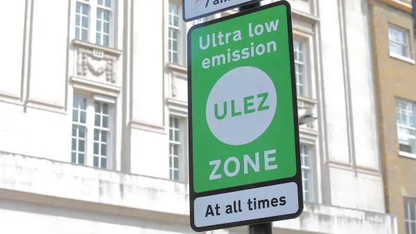 Close-up of green ULEZ sign in London, UK.
