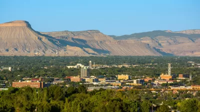 View of downtown Grand Junction, Colorado with mesas in background.