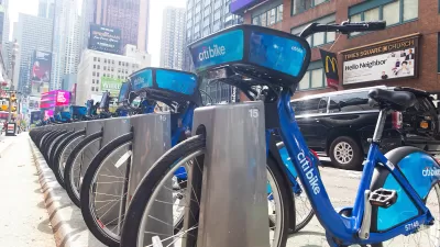Blue Citi Bike bike share bikes parked at a station near Times Square in New York City