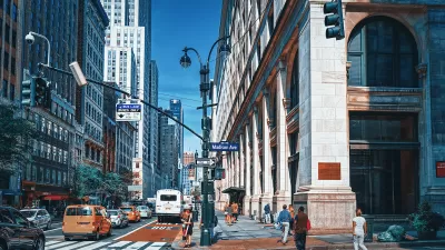 Busy street with red painted bus lane in midtown Manhattan, New York City.