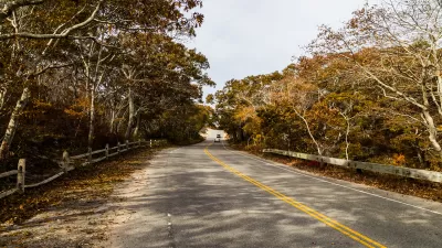 Route 6 highway in Massachusetts with fall trees on either side