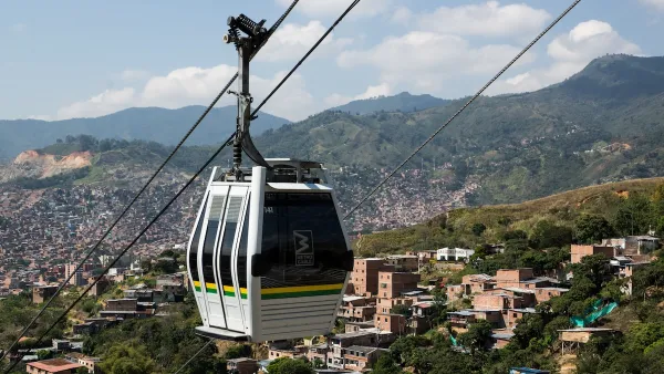 Aerial tram moving along cable in hilly area in Medellin, Colombia.