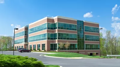 Three-story modern suburban office building.