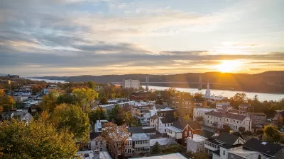 Aerial view of small town in Hudson Valley, New York State with river at sunset.