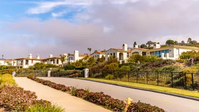 Row of white Spanish Revival-style homes in Torrance, California.