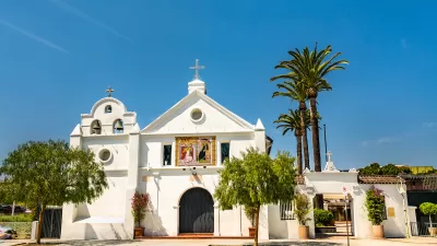 Small white historic Catholic church in Los Angeles, California.