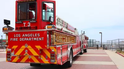 Red Los Angeles Fire Department fire truck parked on pier in San Pedro, California at Port of Los Angeles.