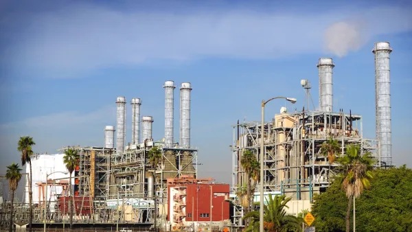 Power plant with palm trees in foreground in California.