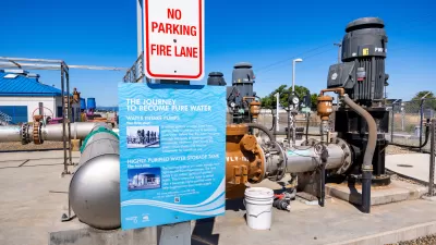 Sign about water purification process mounted on water treatment plant in Santa Clara, California