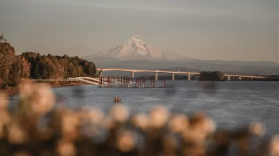View of Interstate 205 bridge over Columbia River with Mt. Hood in background.