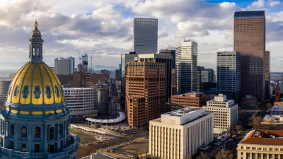 Aerial view of gold state capitol dome in Denver, Colorado and Denver skyline.