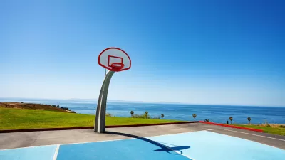 Beachside basketball couty with ocean view and blue painted court at Angel Gate Park in Los Angeles, California on a sunny day